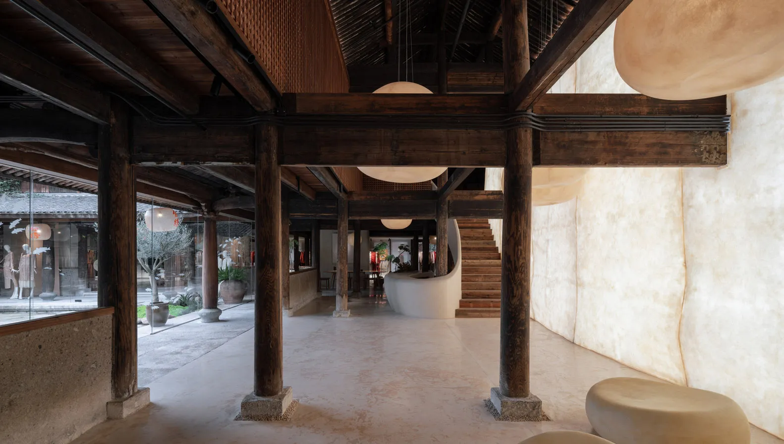 A modern retail storefront with a concrete floor and walls.