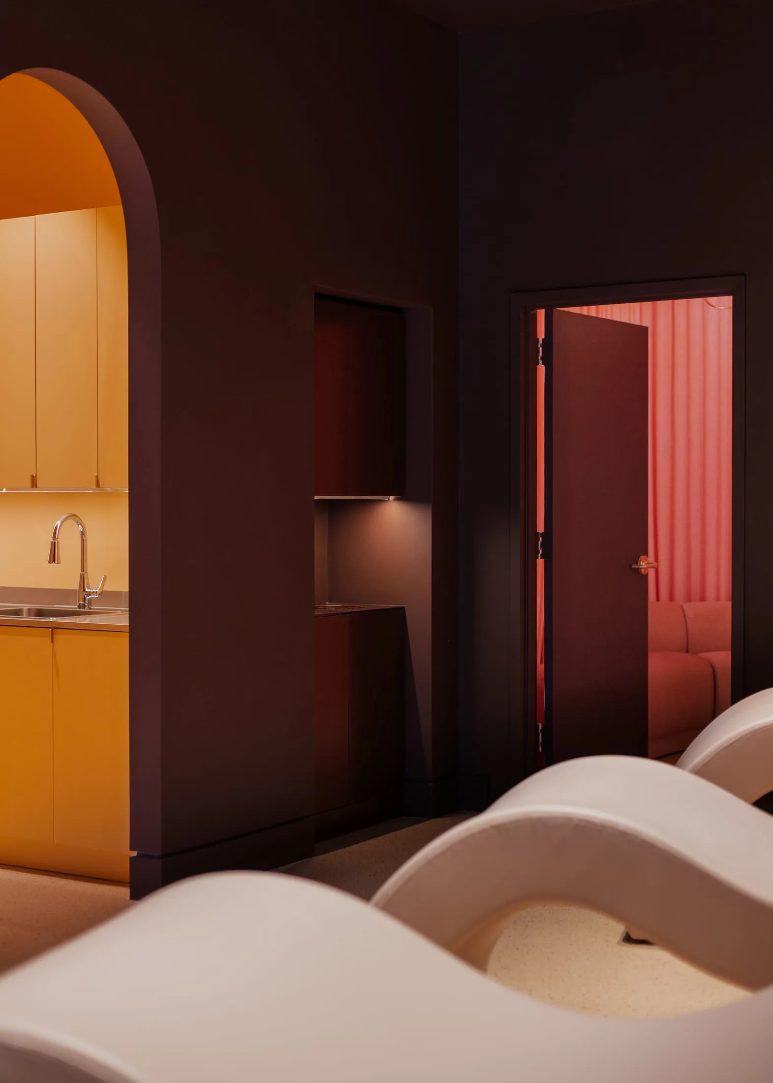 Modern minimalist living space featuring sleek, contemporary furniture and a cohesive color palette.