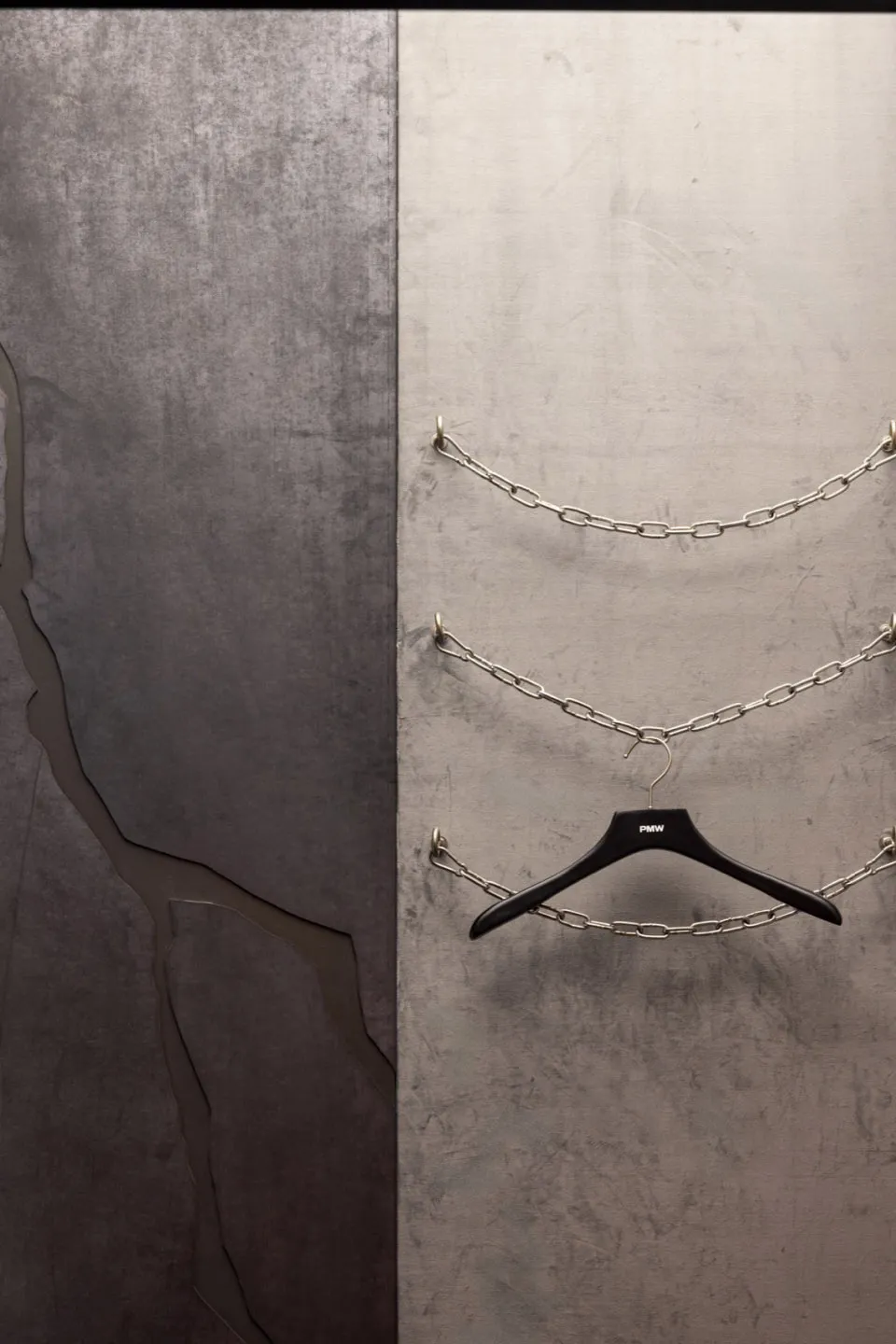 An industrial-style art installation featuring metal chains