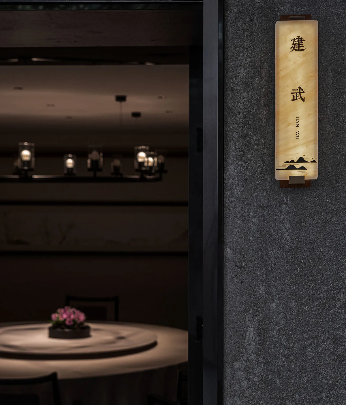 Marble restaurant interior with elegant lighting and signage