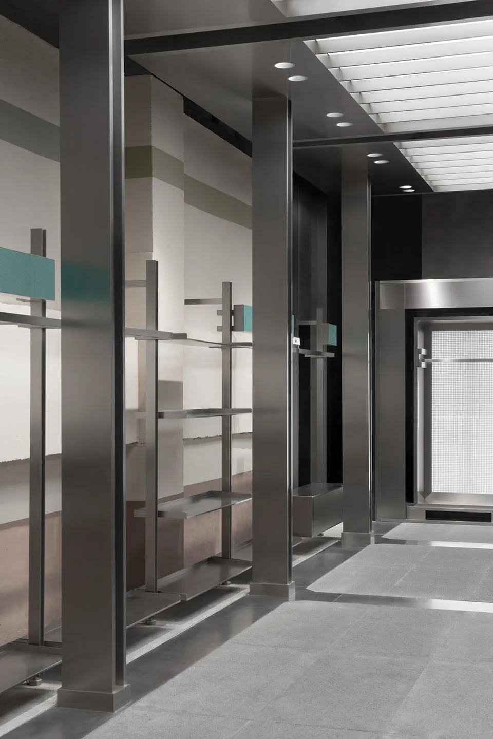 Modern minimalist office space with metal, wood, and concrete elements.