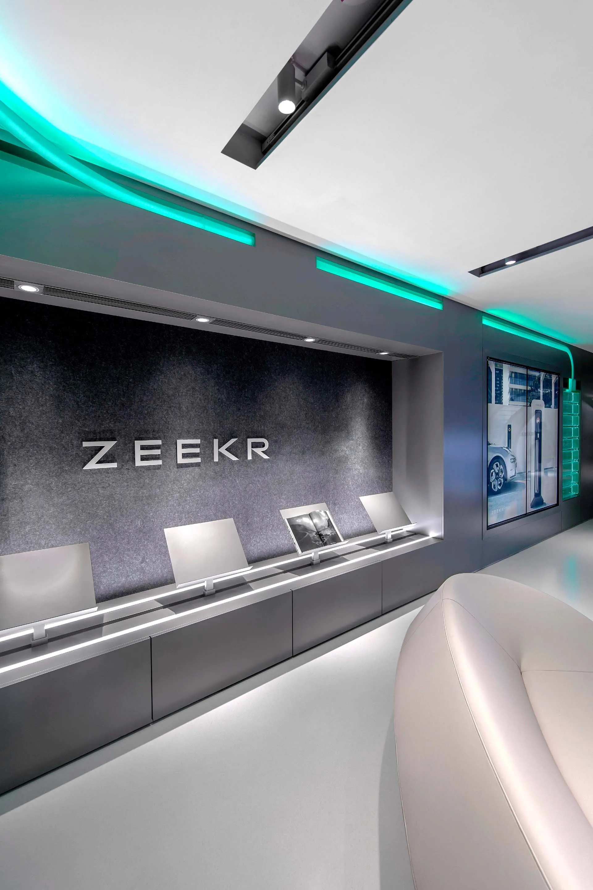 Modern retail storefront with large glass windows and wall-mounted displays.