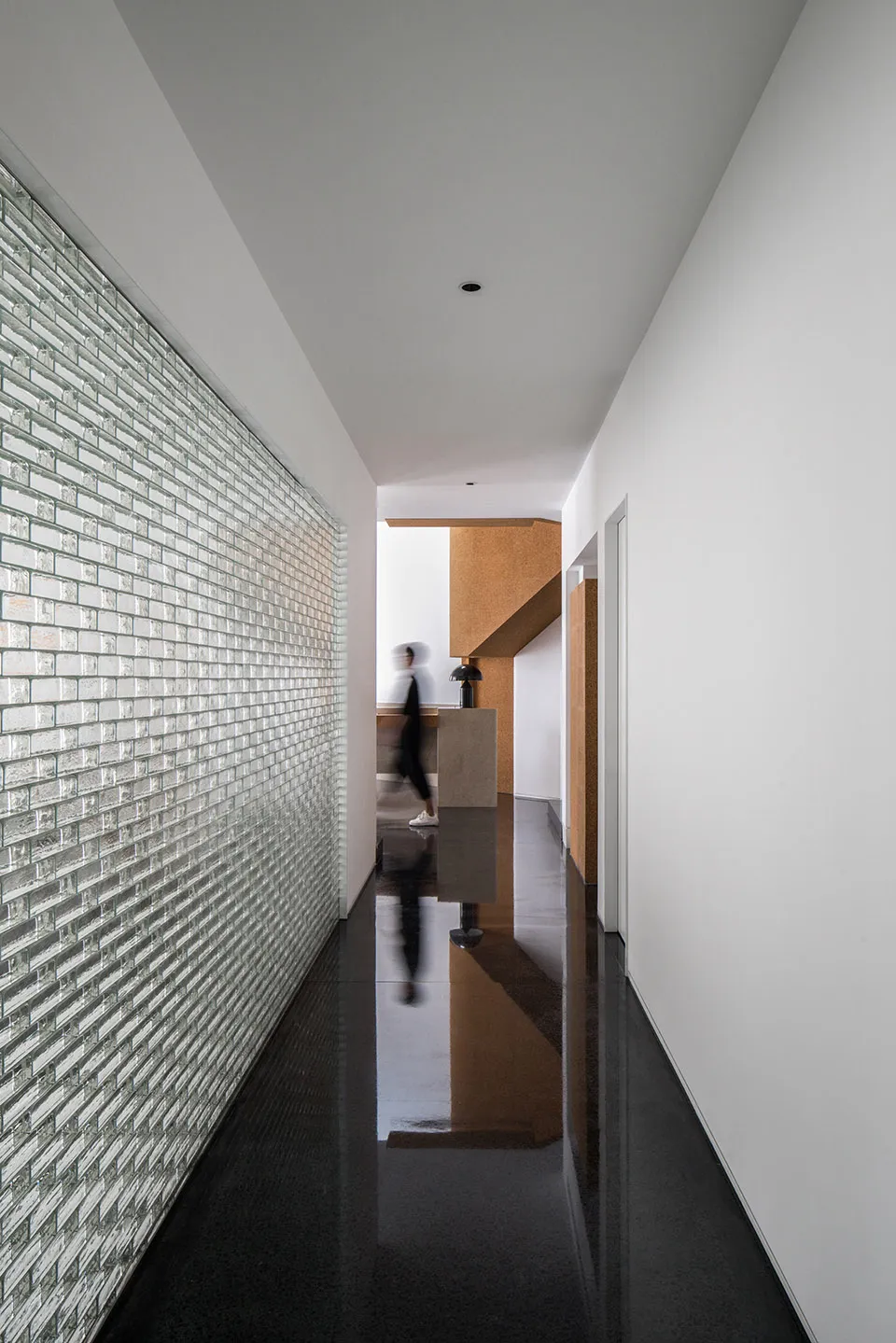 A modern interior design space featuring a glass wall.