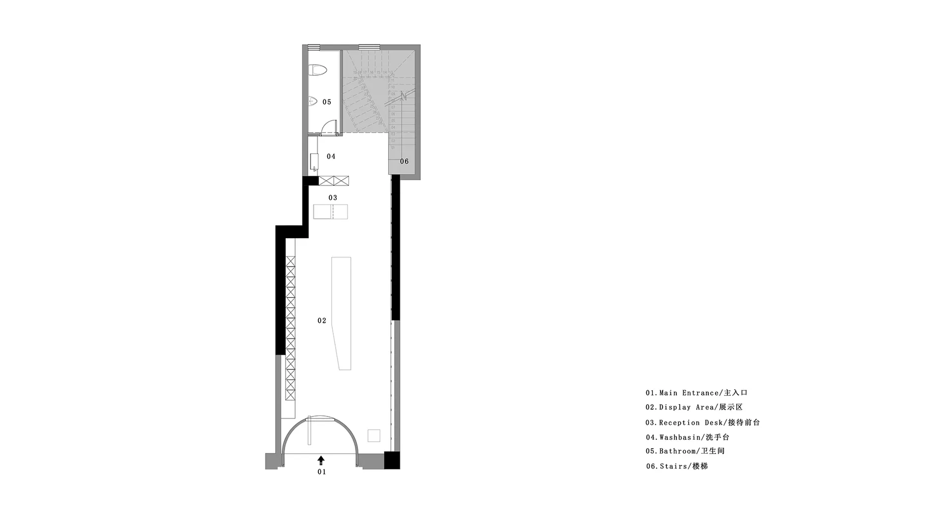 A grey-scale architectural floor plan of a showroom with concrete walls and a staircase.
