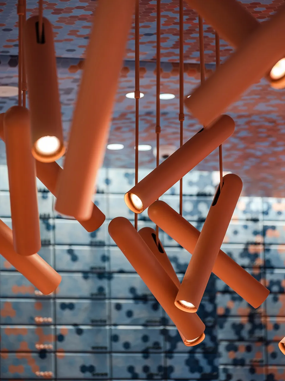 Close-up of modern industrial lighting fixtures in a contemporary setting.