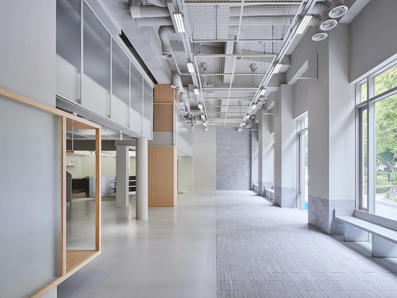 Modern office lobby with a concrete floor and minimalist design