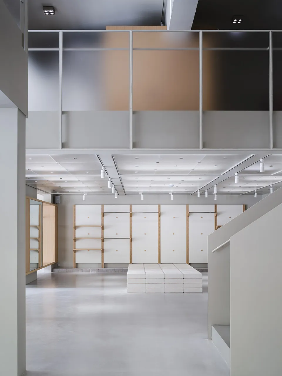 A modern retail store with concrete walls and minimalist design.