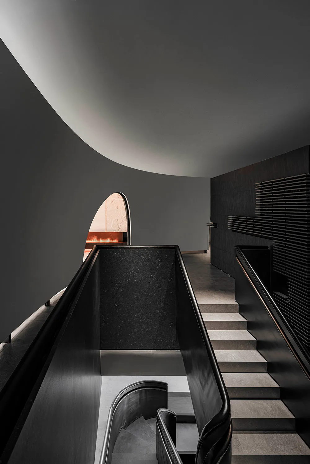 Modern interior design featuring black metallic stairs and escalator.