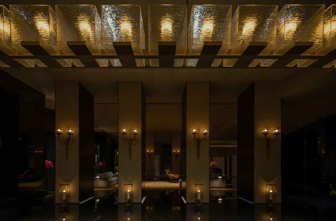 An elegantly designed hotel lobby featuring modern neoclassical fixtures and decor.