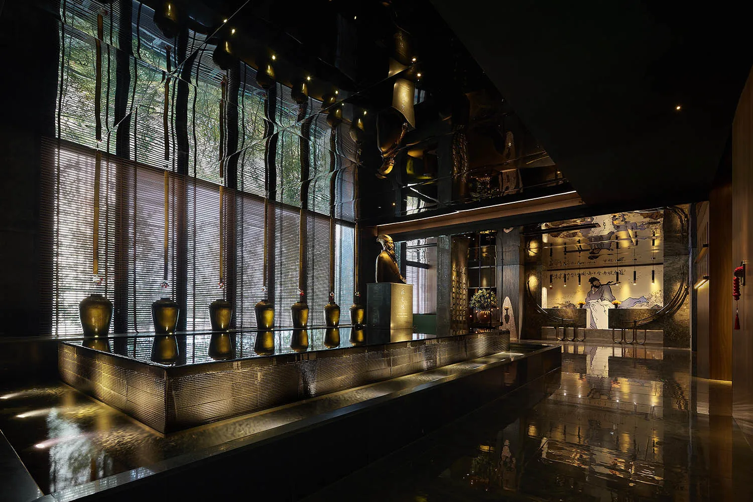 A modern hotel lobby with glass walls and decorations.