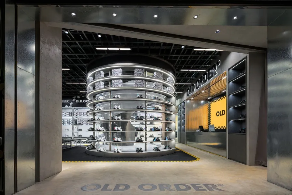 A minimalist retail space with metal, steel, and glass displays.