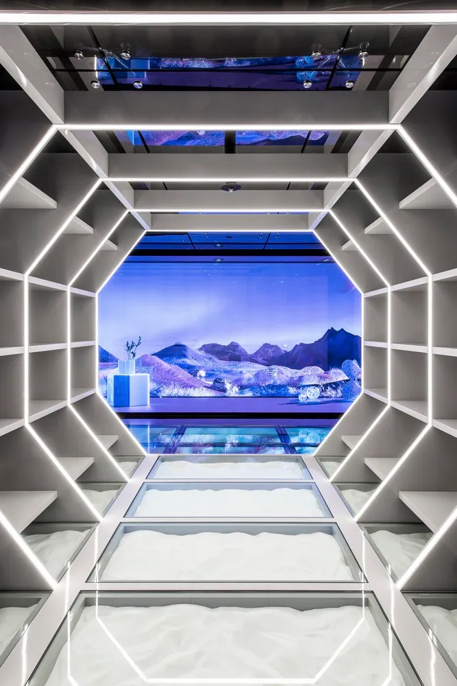 A futuristic showroom with a modern retail storefront showcasing contemporary glass design.