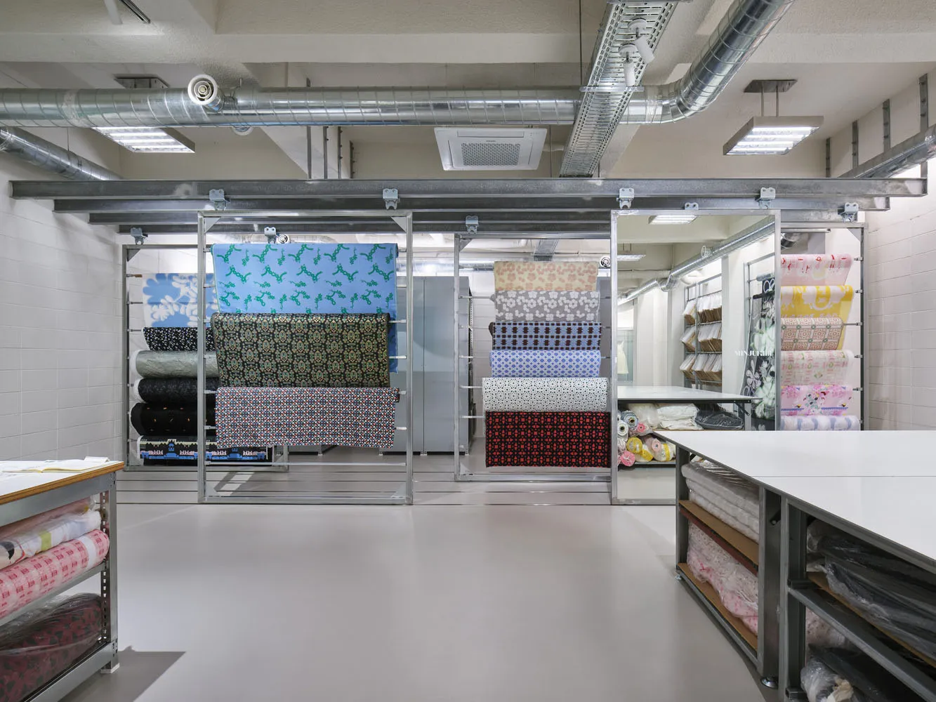A fabric shop displaying various patterns and designs of fabric.