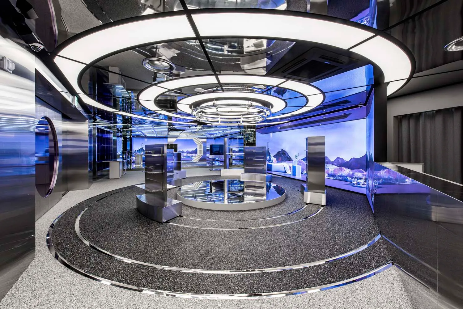 A modern retail shop featuring metallic and glass materials with a futuristic design.