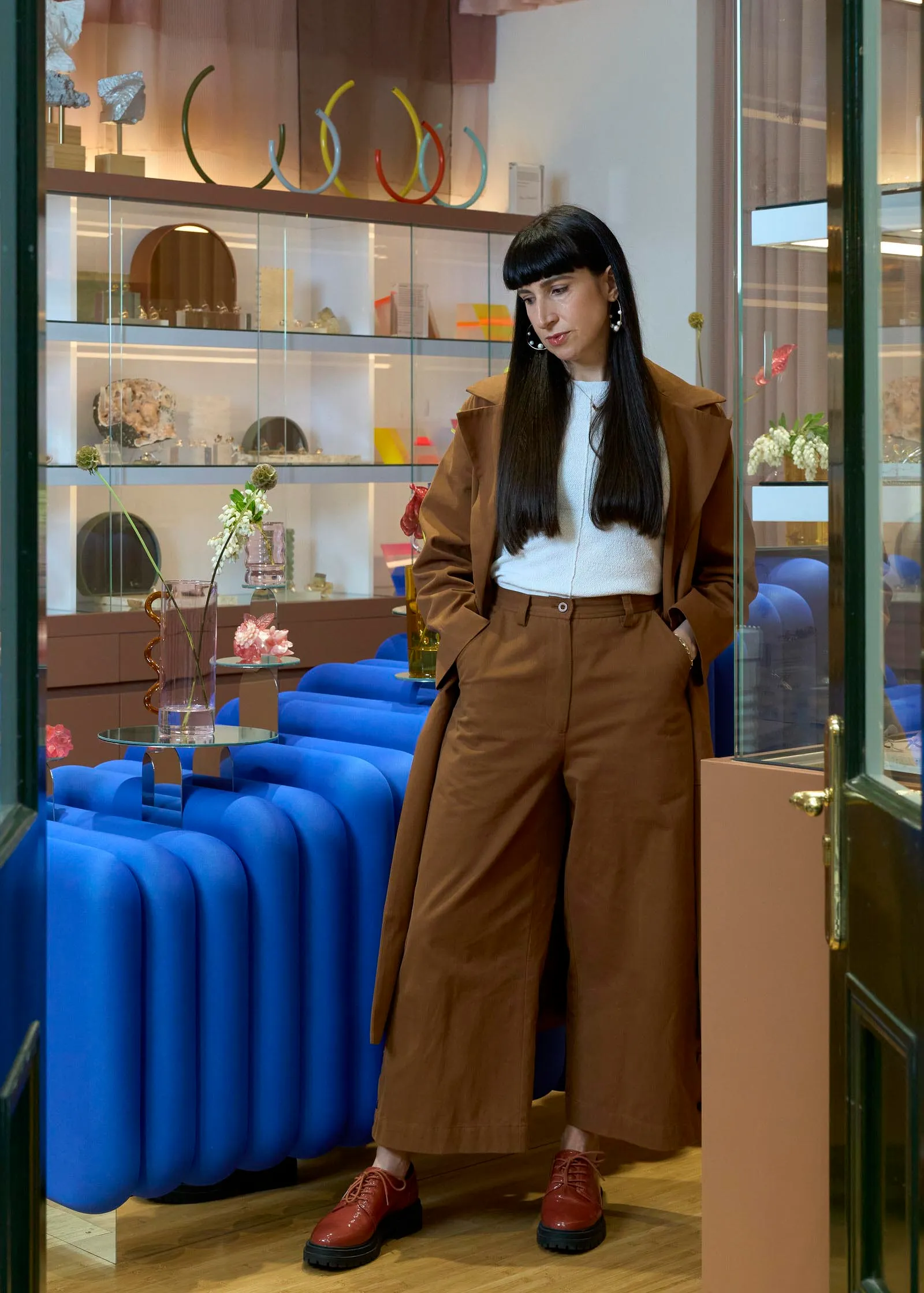 A modern retail space with a mix of materials and brown tones.