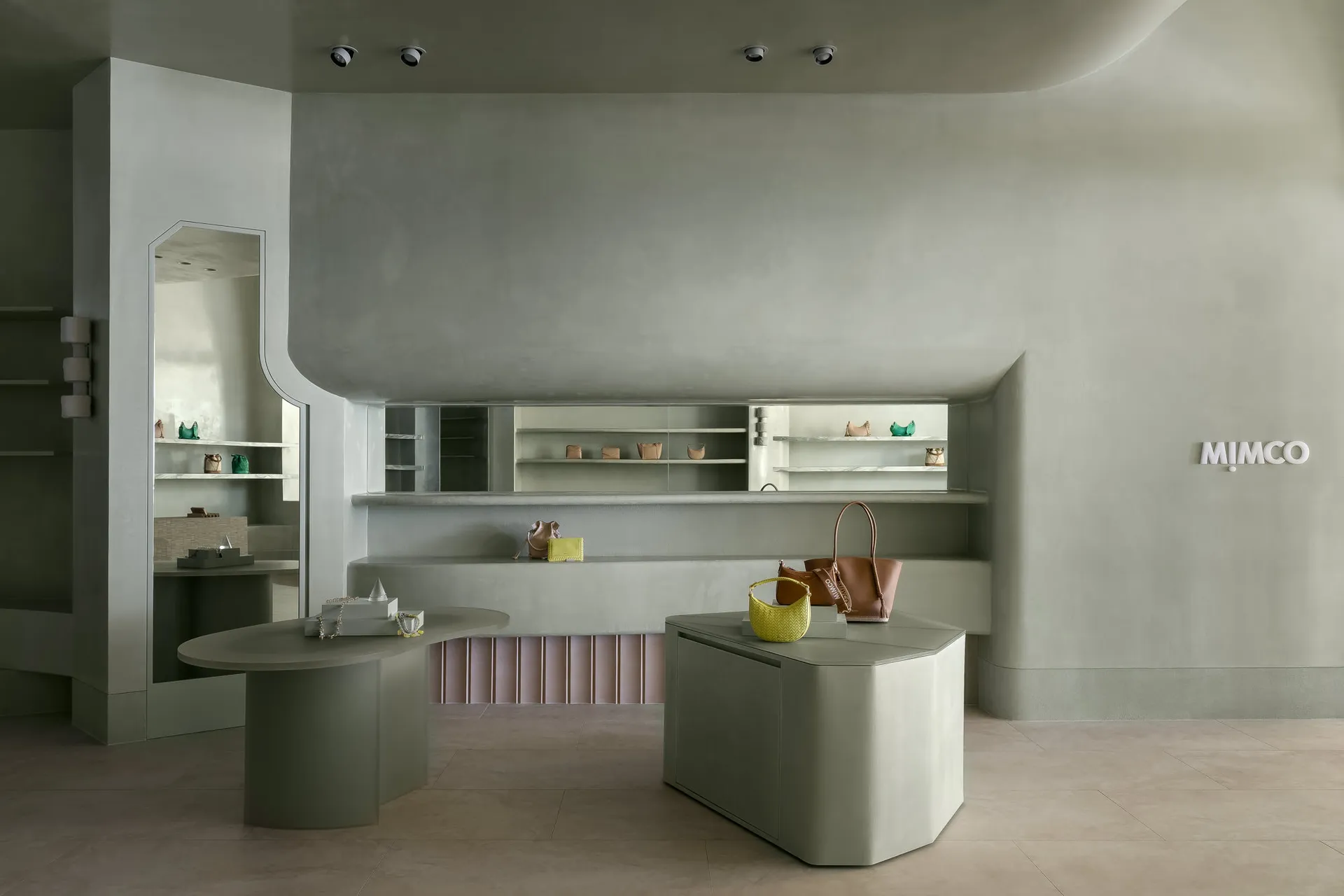 A minimalist retail storefront with concrete finishes and modern design elements.