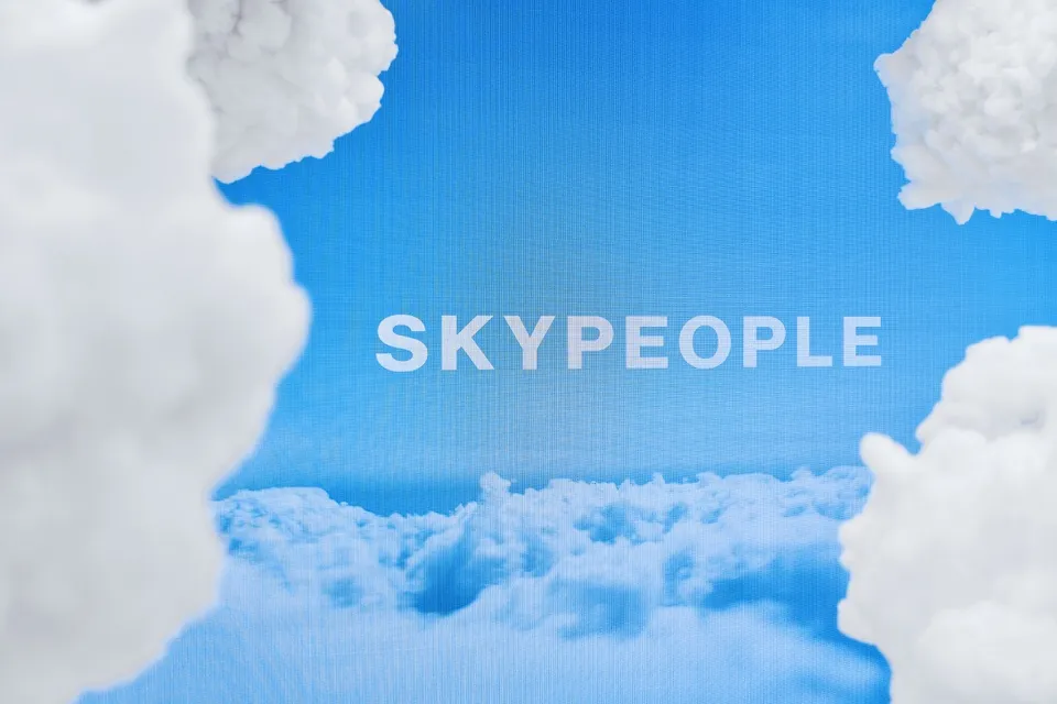 White fluffy clouds against a blue sky background
