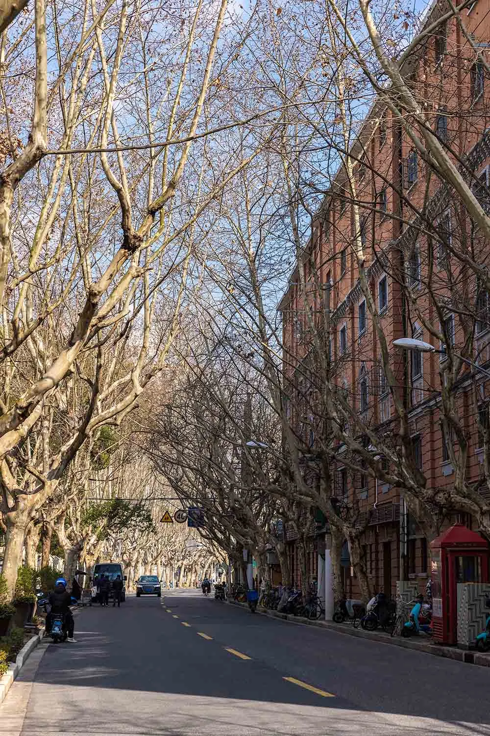 A street lined with brick and stone buildings.