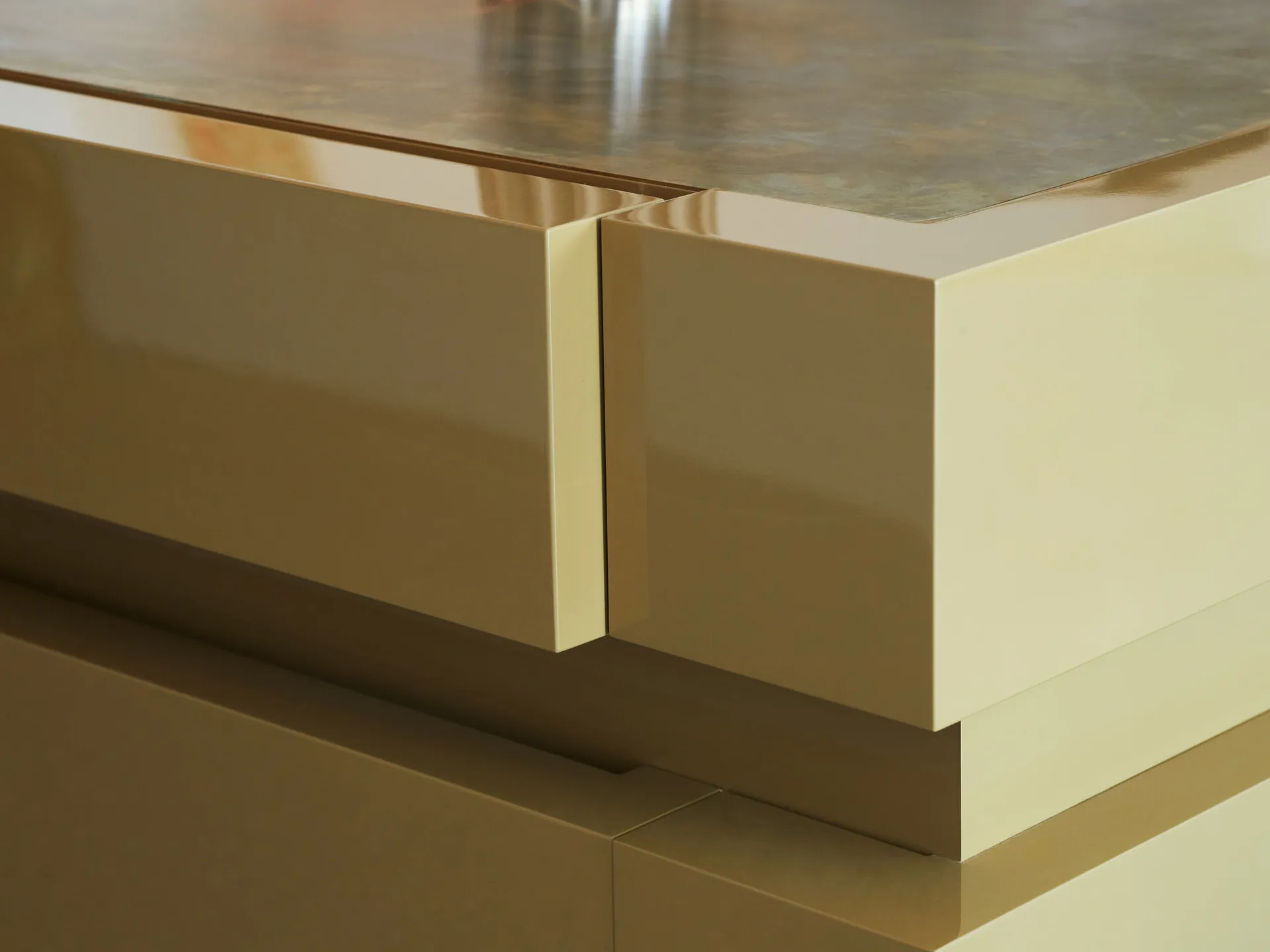 Close-up view of a minimalist interior design with metallic finish.