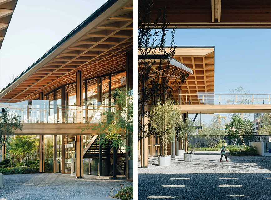 A modern architectural building exterior with wooden framework and glass panels.