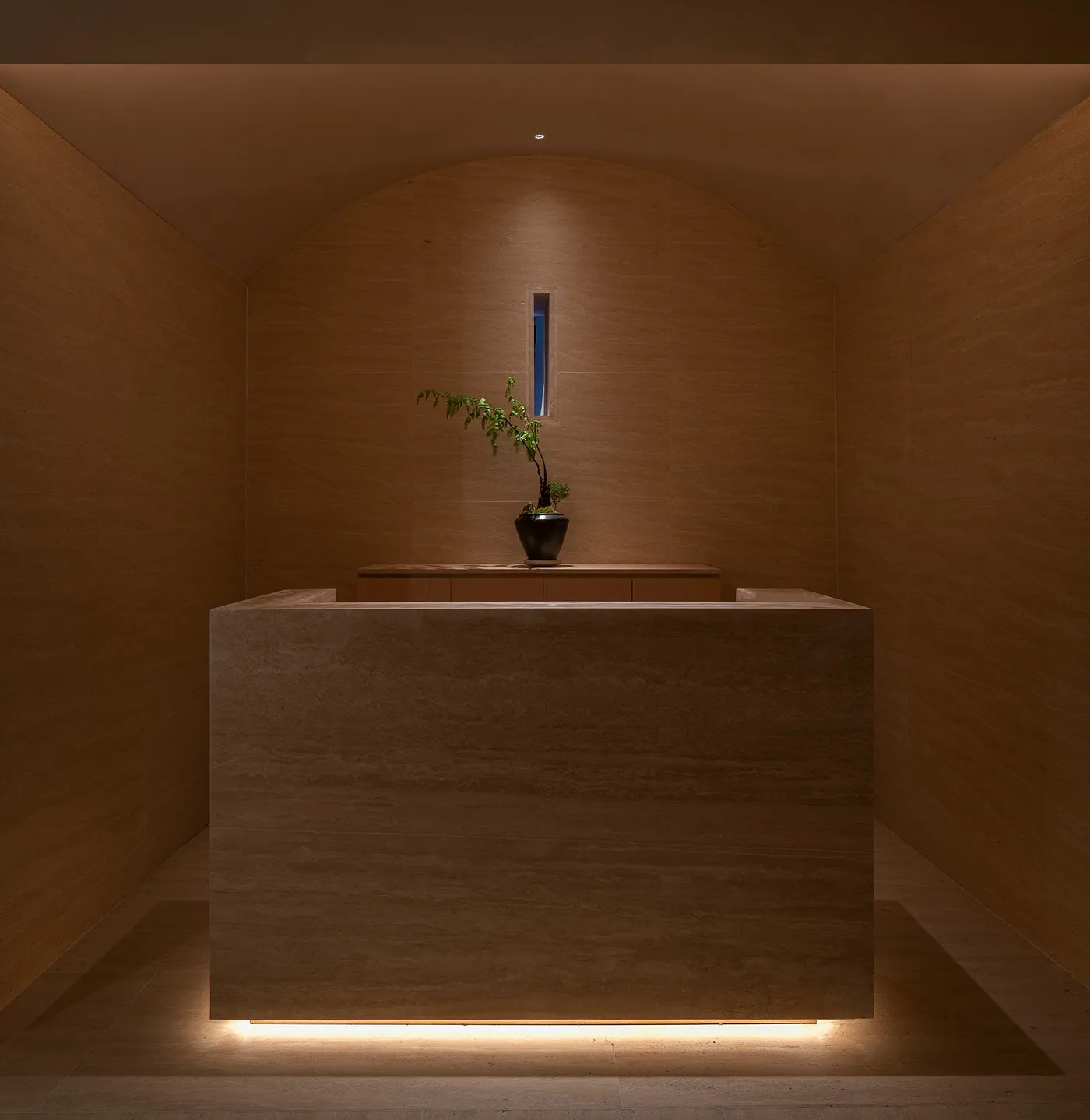 A photo of a modern reception desk made of marble.