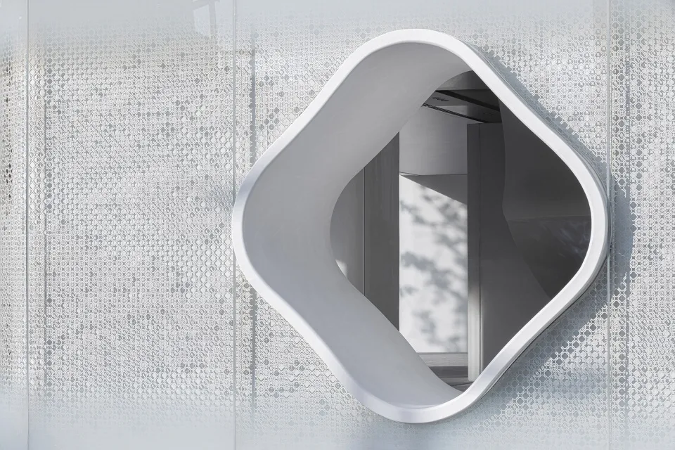 Angular, metallic window opening in a modern architectural façade.