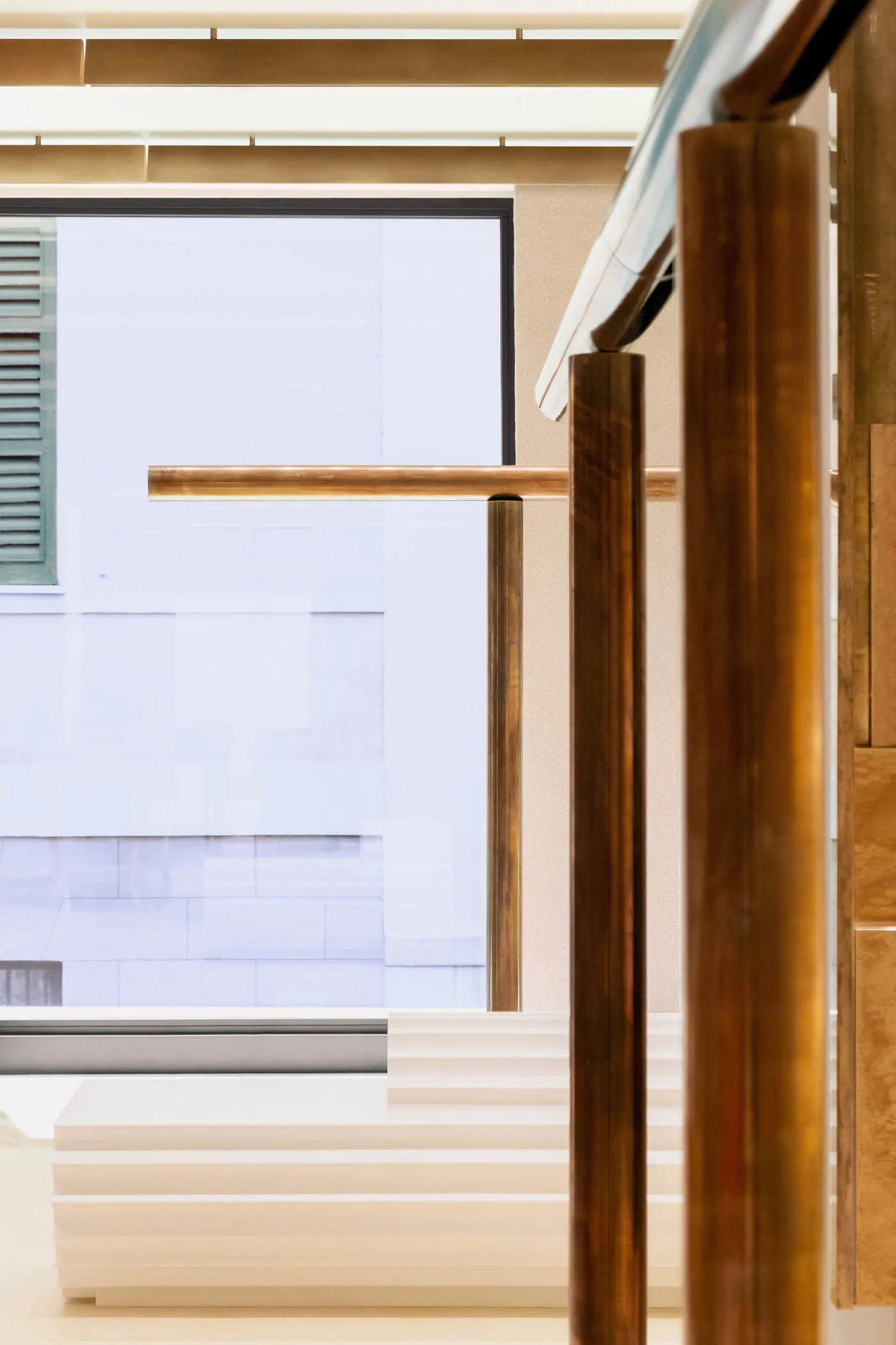 Modern interior featuring marble stairs with metal railings