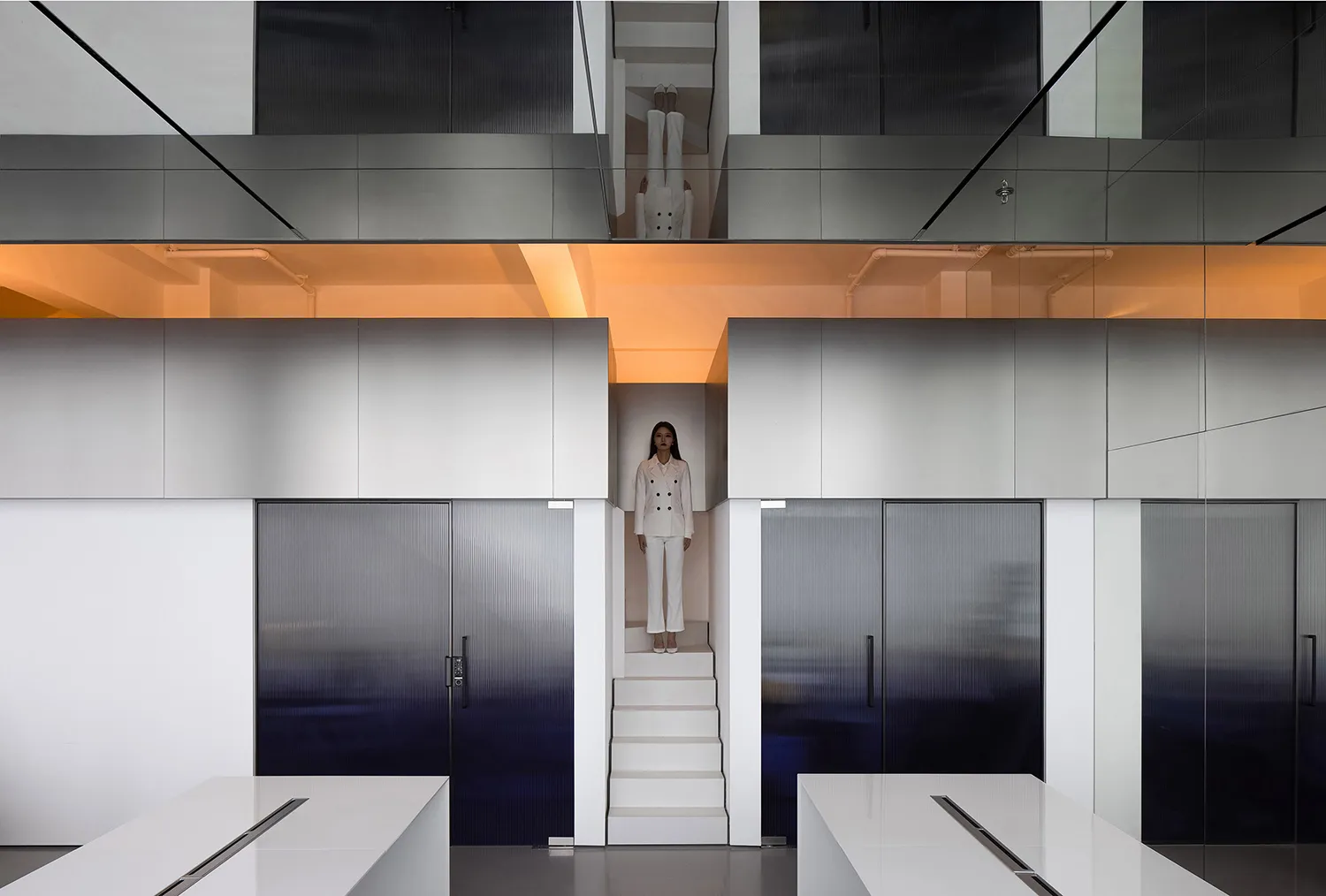 A minimalist office interior with metallic finishes and sleek design elements.