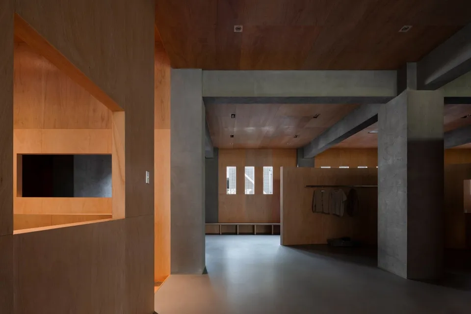 Industrial-style modern interior design featuring wooden and concrete materials.
