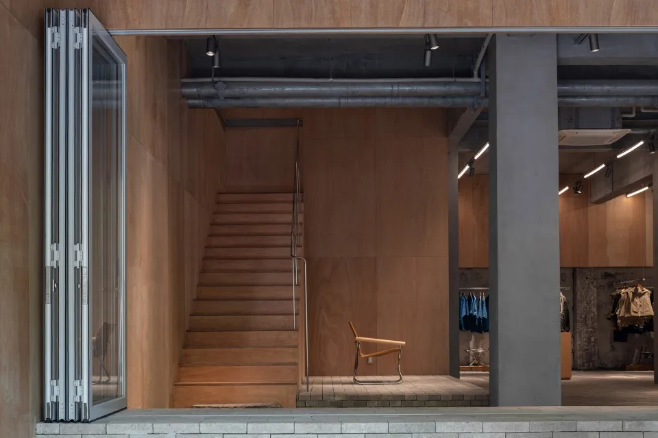 A modern retail storefront featuring wooden materials and a minimalist design.