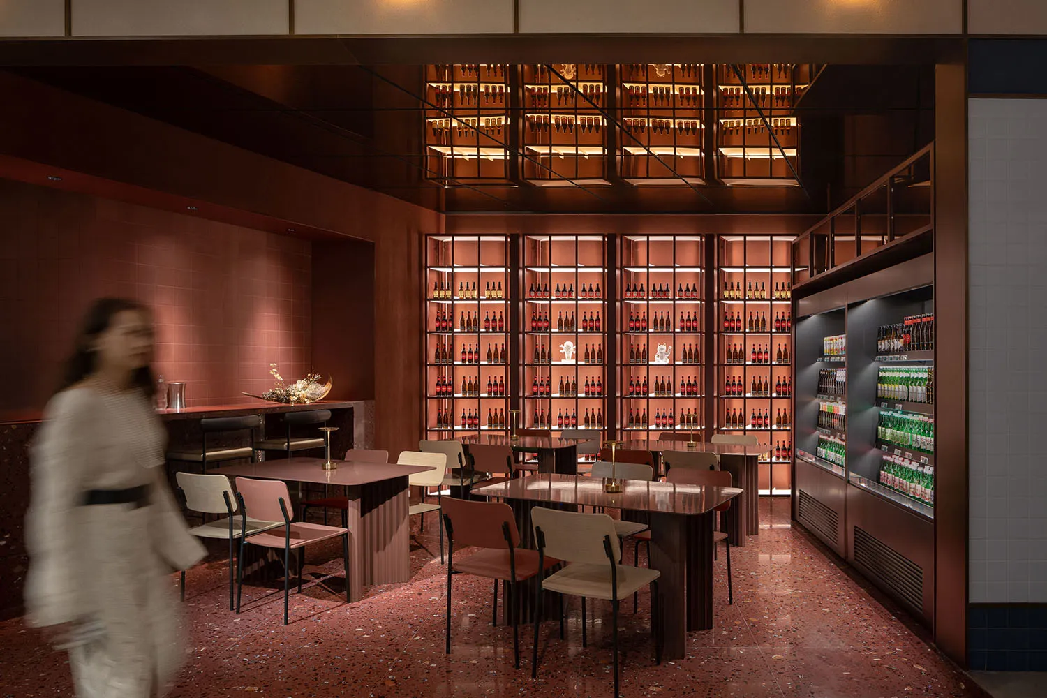 Modern interior design of a restaurant-bar with metallic and glass elements.