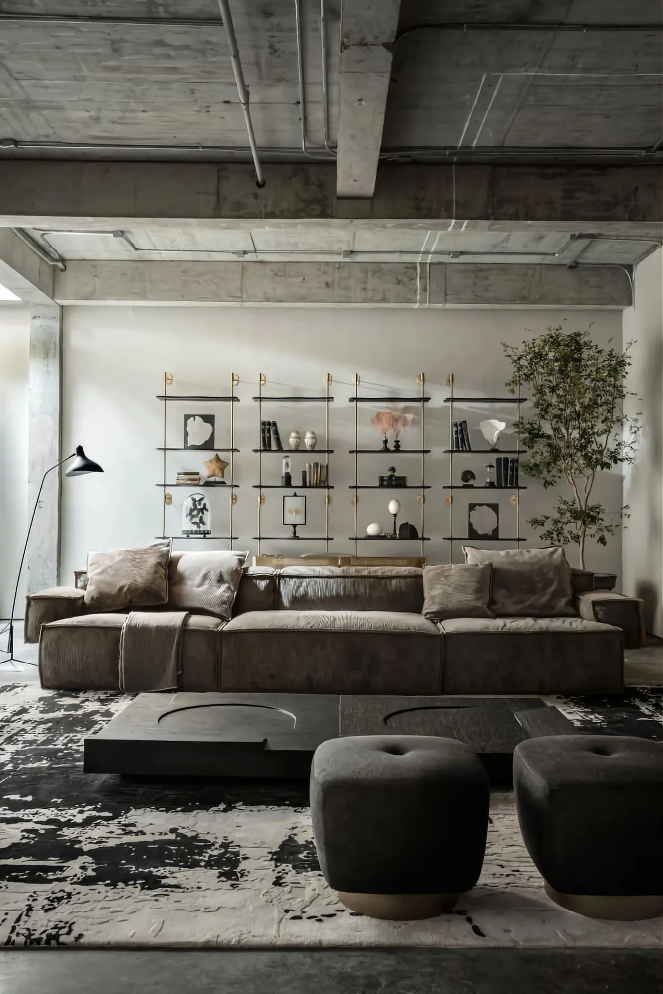 Modern industrial living room with concrete walls, floor, and shelves.