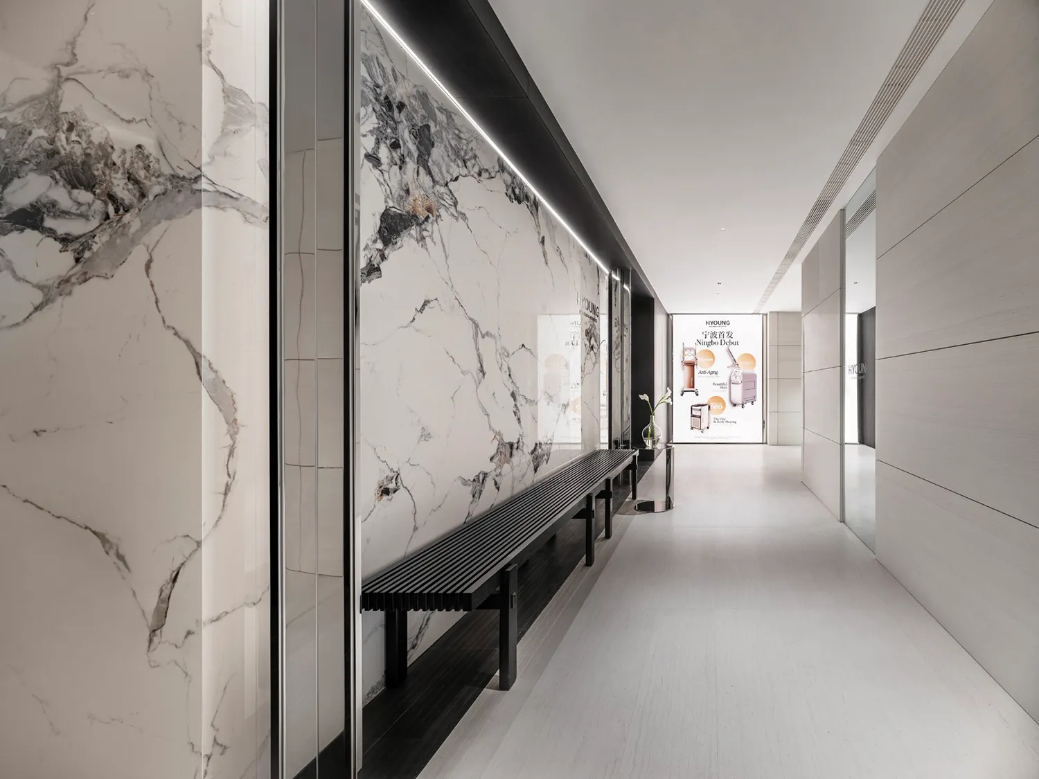 Modern furniture and marble glass walls in a corridor interior design