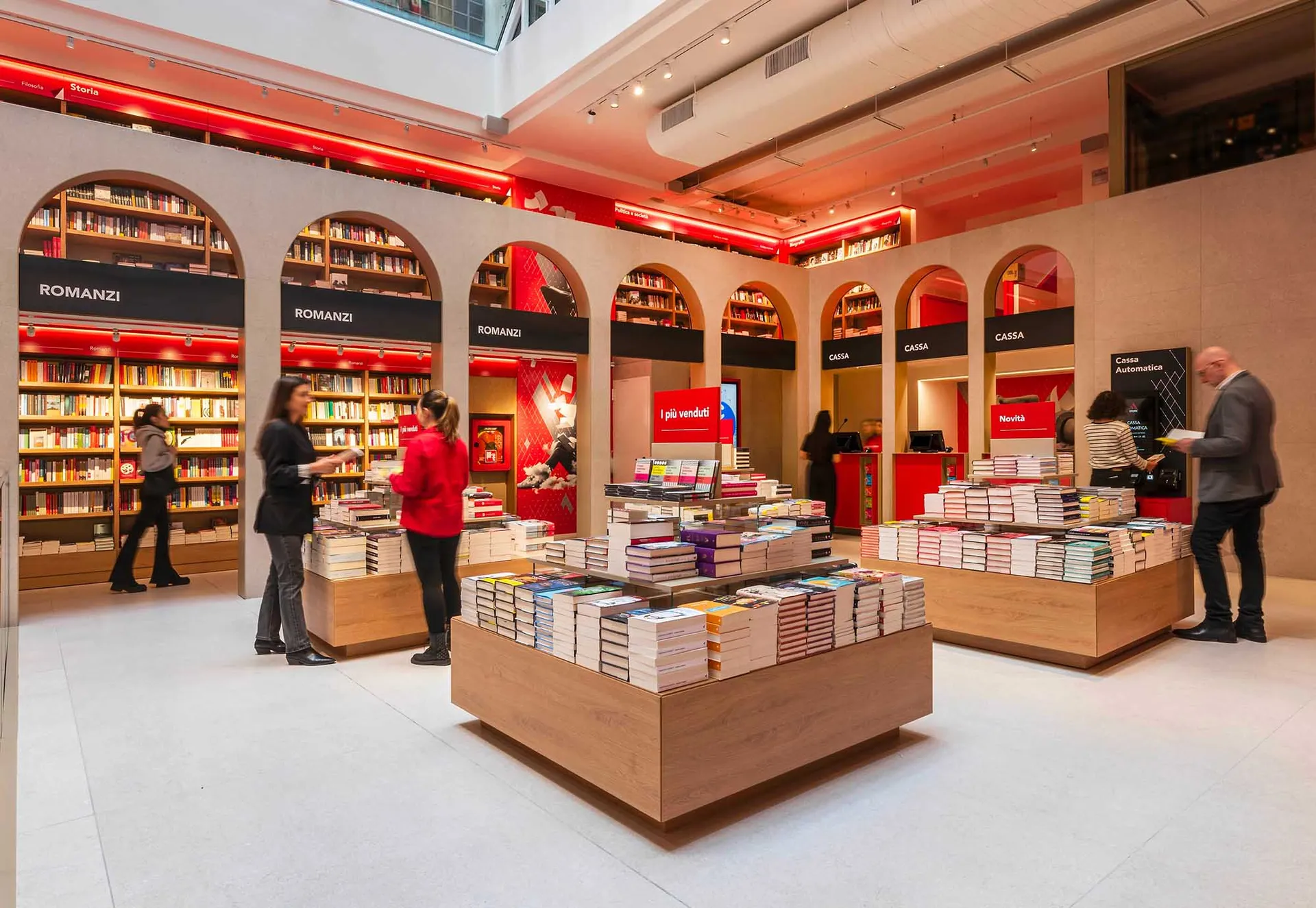 Modern bookstore with wooden shelves and a variety of books on display