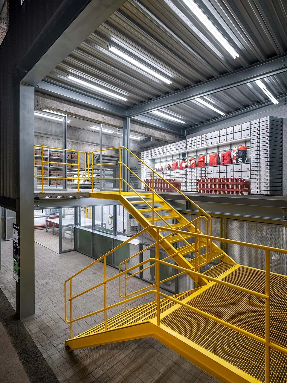 A modern industrial logistics center with metal and glass features for efficient material handling and storage.