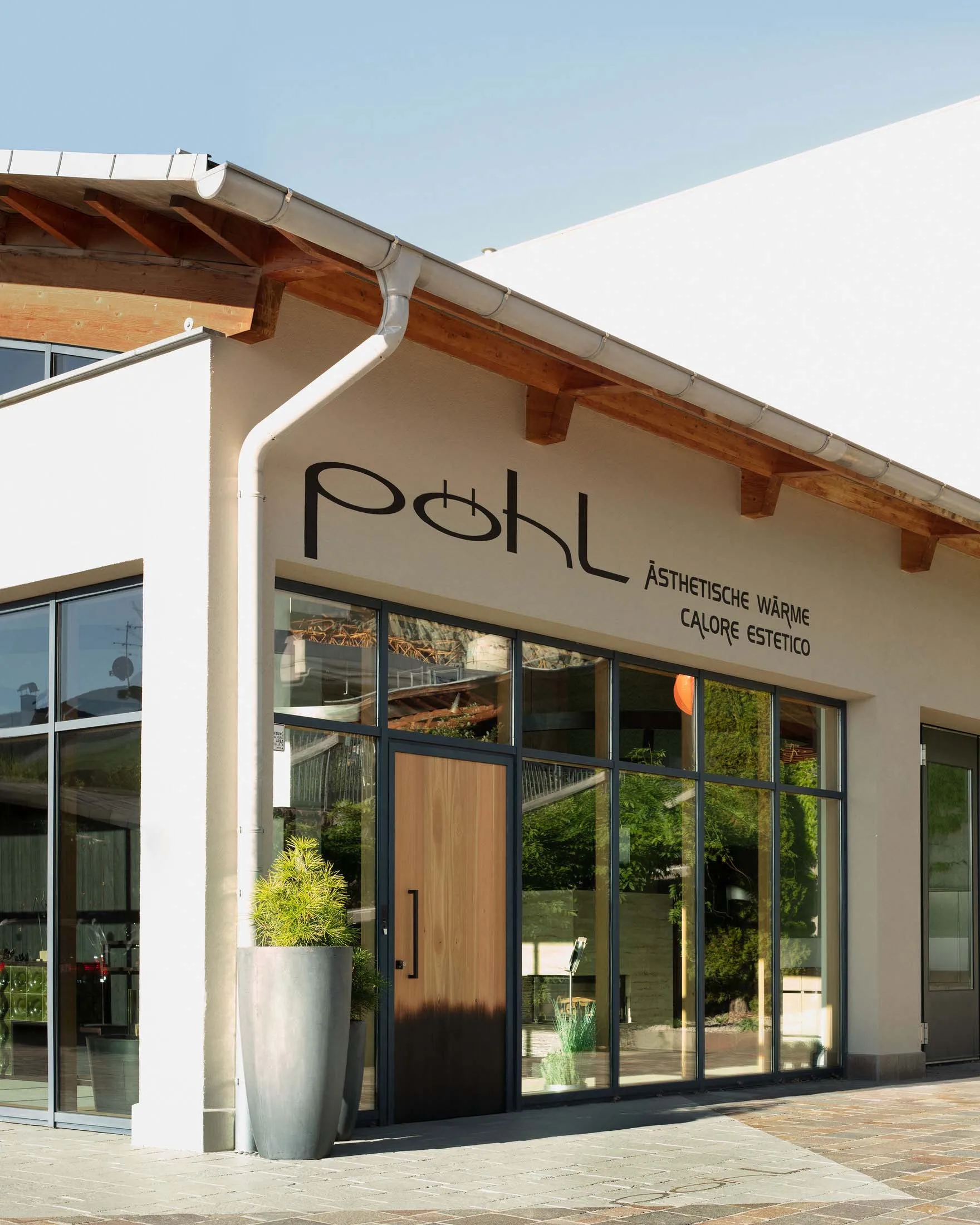 Modern retail storefront with glass glazing and wooden accents
