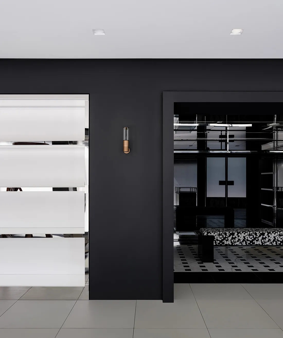 Modern interior design featuring minimalist black and white living room with metallic and glass elements