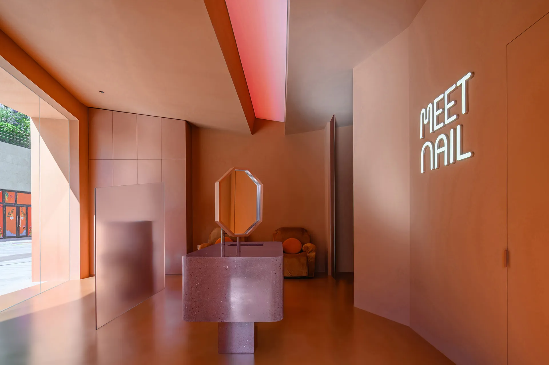 A modern nail salon with sleek, minimalist design and concrete finishes.