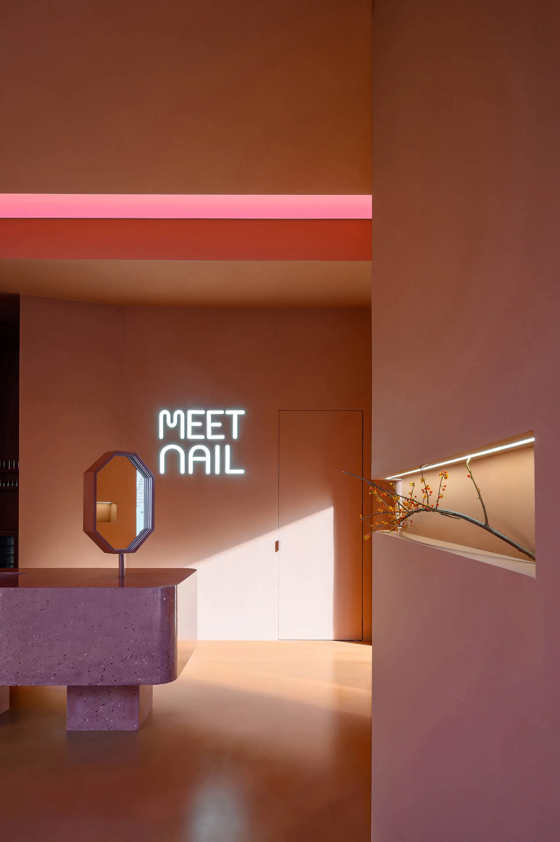 A modern commercial space with a sleek, minimalist design featuring concrete finishes.
