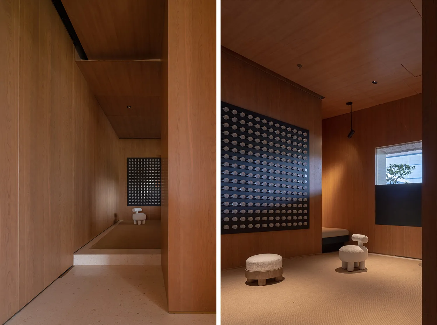 Modern residential room featuring wood paneling and minimalist furniture.