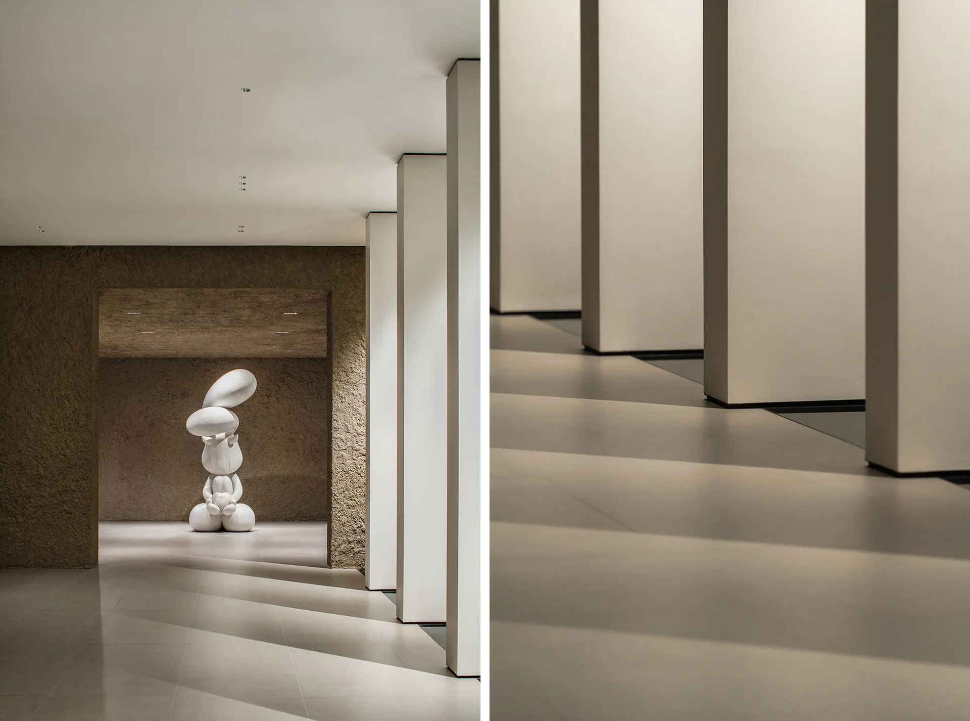 A modern interior space featuring a white concrete sculpture with abstract shapes.