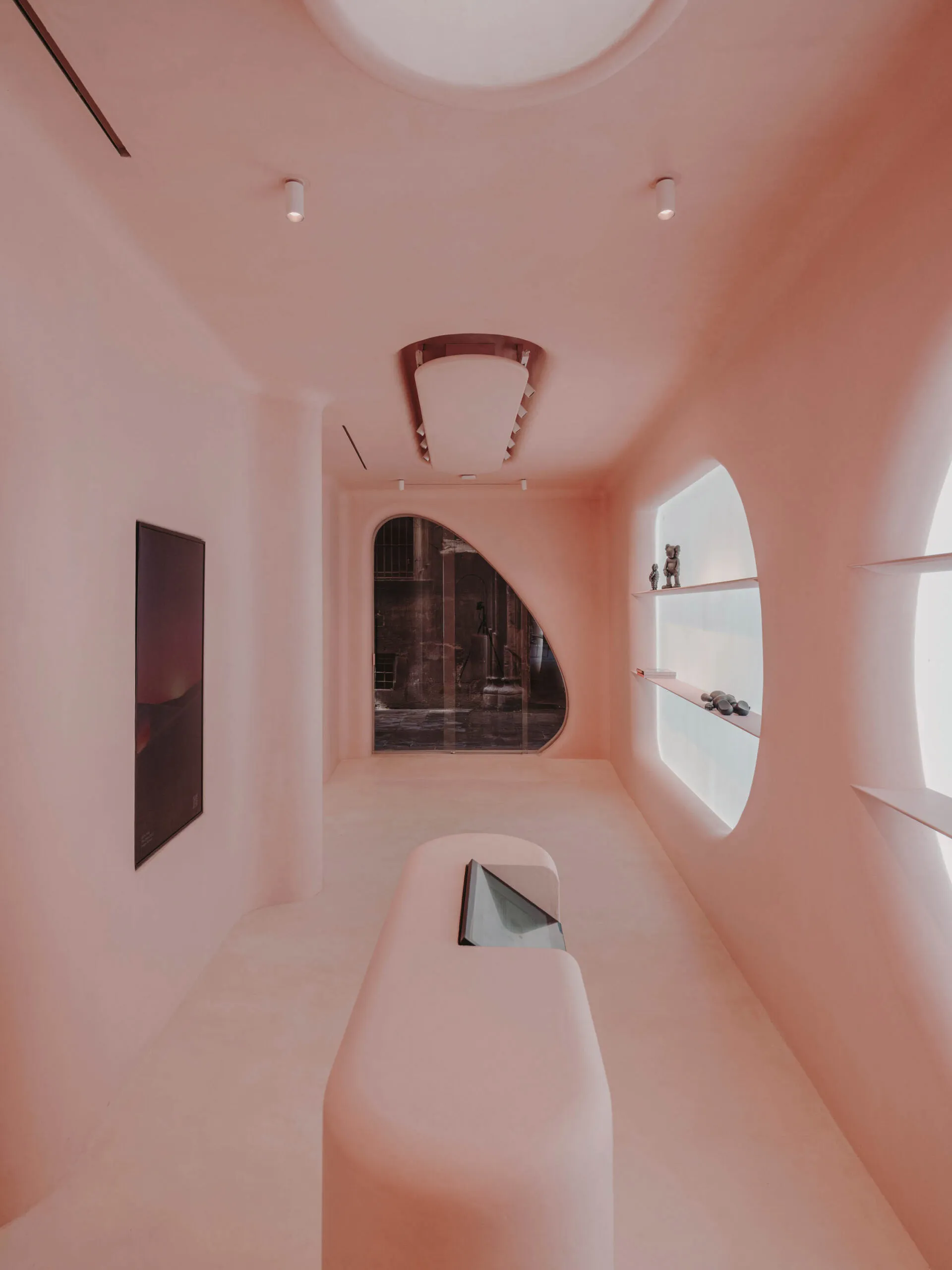 Minimalist retail store with a clay-textured interior, showcasing unique and aesthetic design elements.