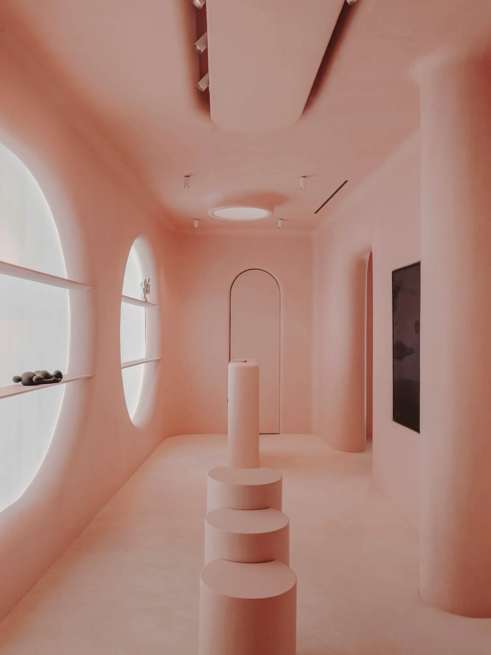 A modern interior space with smooth concrete walls and a sleek, minimalist design.