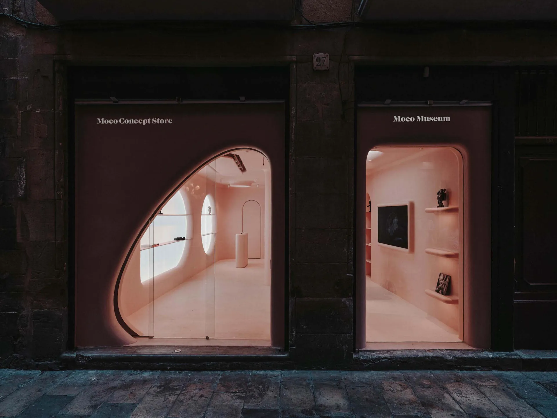 Modern retail storefront with a minimalist design featuring clean lines and soft lighting.