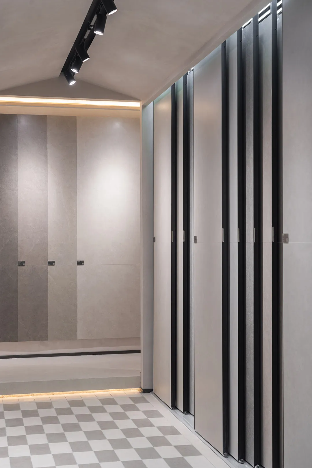 Modern, minimalist retail store interior with concrete walls and floors.