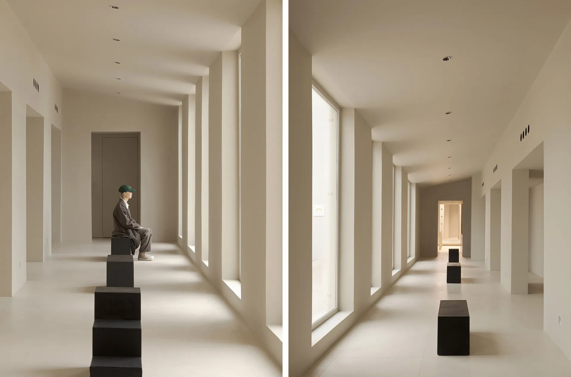A minimalist hall with white columns and large windows.