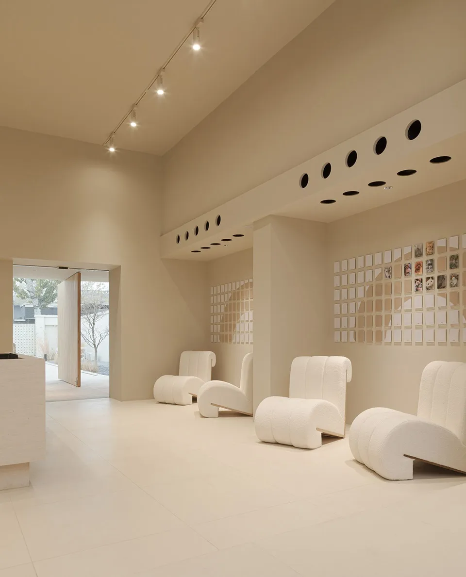 A retail storefront featuring neutral colors and minimalist design.