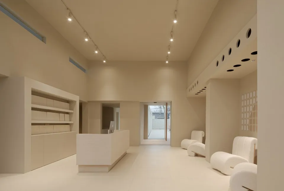 Modern retail shop interior with minimalist design and neutral color palette