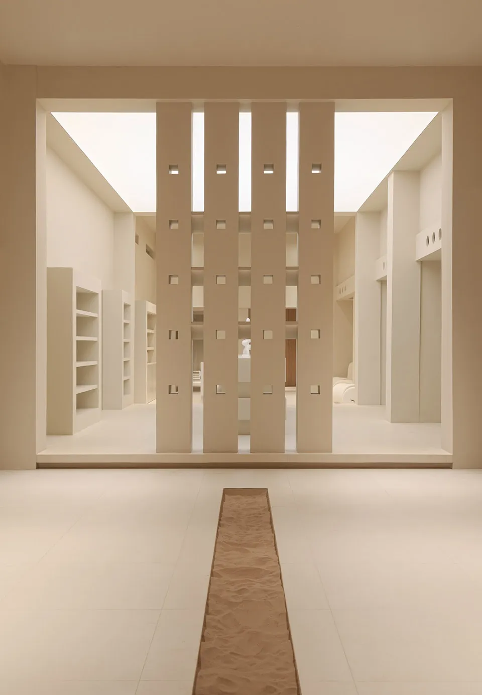 Minimalist architectural space featuring concrete rows on a white tiled floor.
