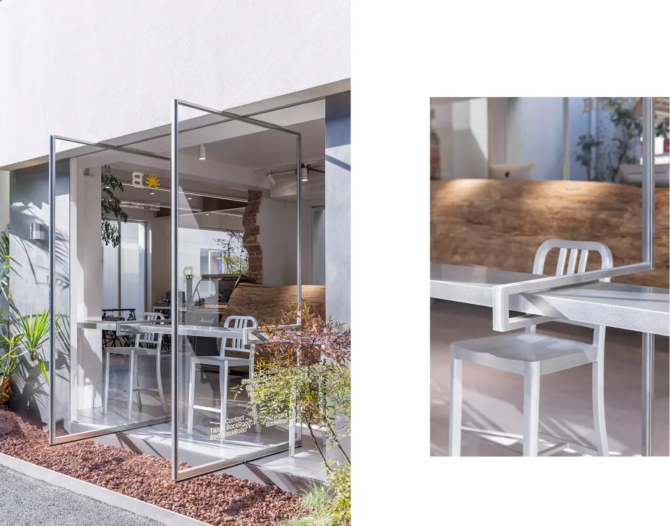 Commercial interior with metallic tables and chairs, featuring clean lines and open space.